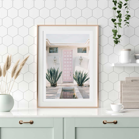 Palm Springs pink front door wall art print with white border, mid-century modern pastel home decor.
