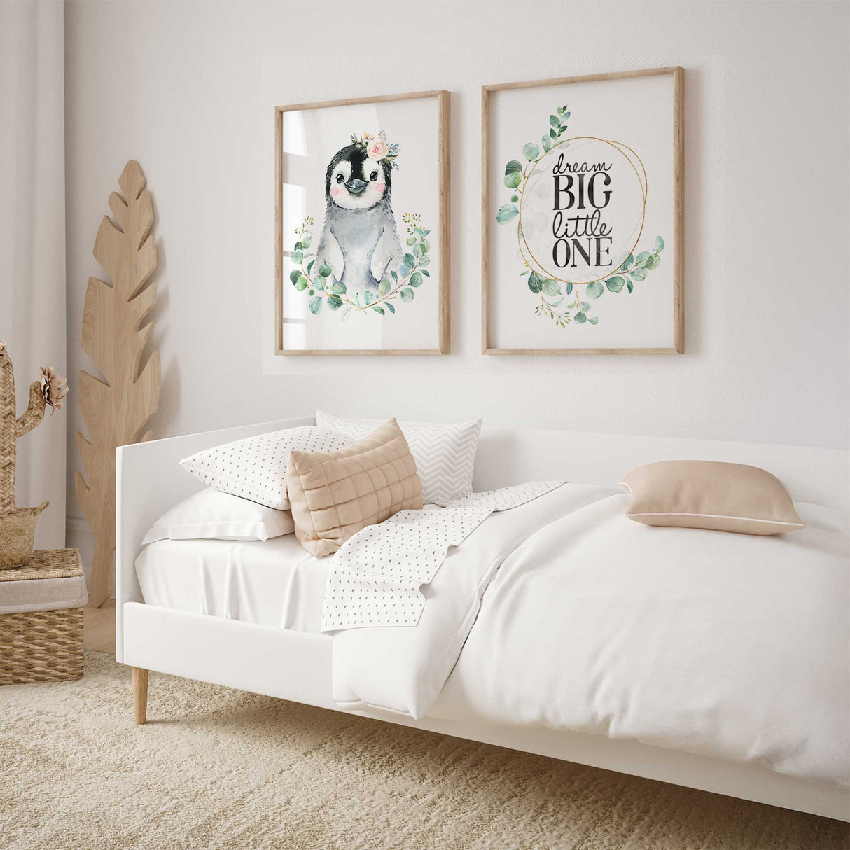 Cute penguin nursery wall art with floral crown and soft greenery for baby room