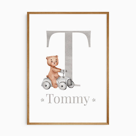 Custom nursery print with large initial and teddy bear riding a toy car, personalised with child’s name – perfect for baby boy room decor.