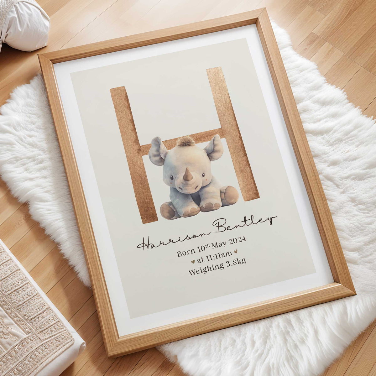 Personalised birth details print with baby’s initial, name, birth date, time and weight in a neutral nursery design