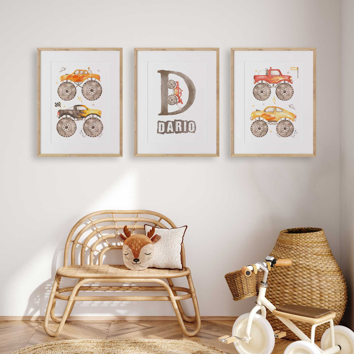 Set of three personalised boys monster truck prints showing colourful vehicles and a custom initial and name design.