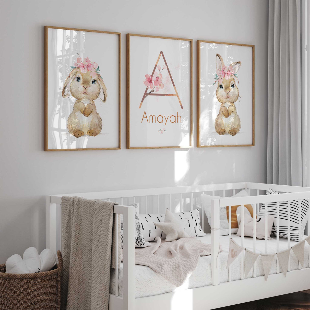 Personalised bunny nursery wall art set of three prints with floral initial and custom name, perfect for girls' bedrooms.
