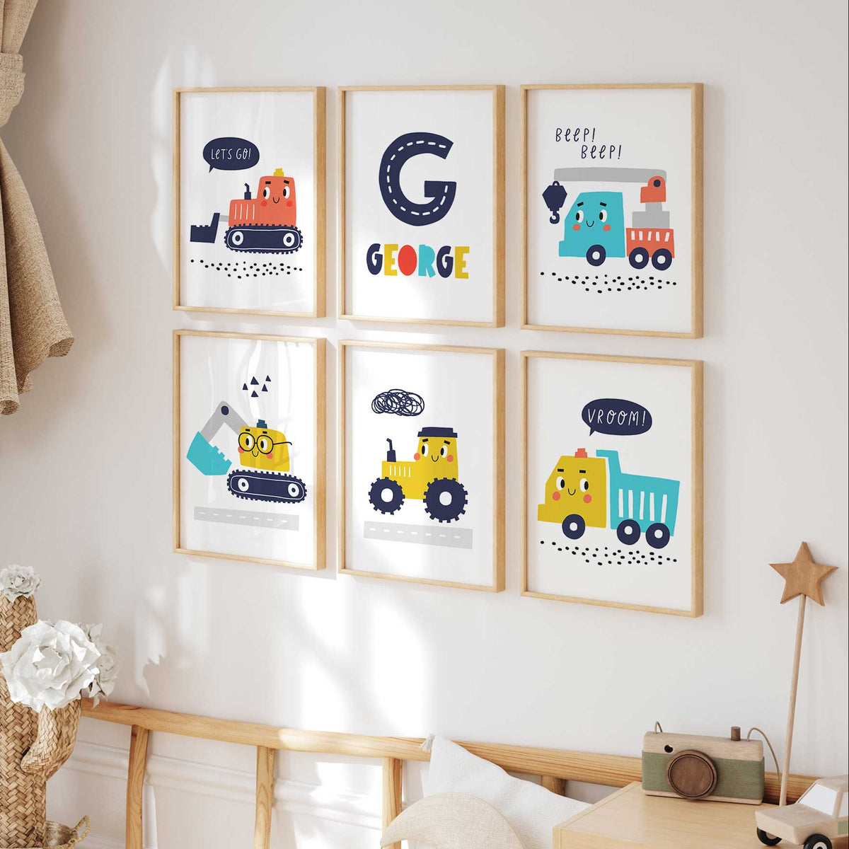 Personalised construction wall art set of six with smiling vehicles in yellow, teal and orange and a road-style initial.