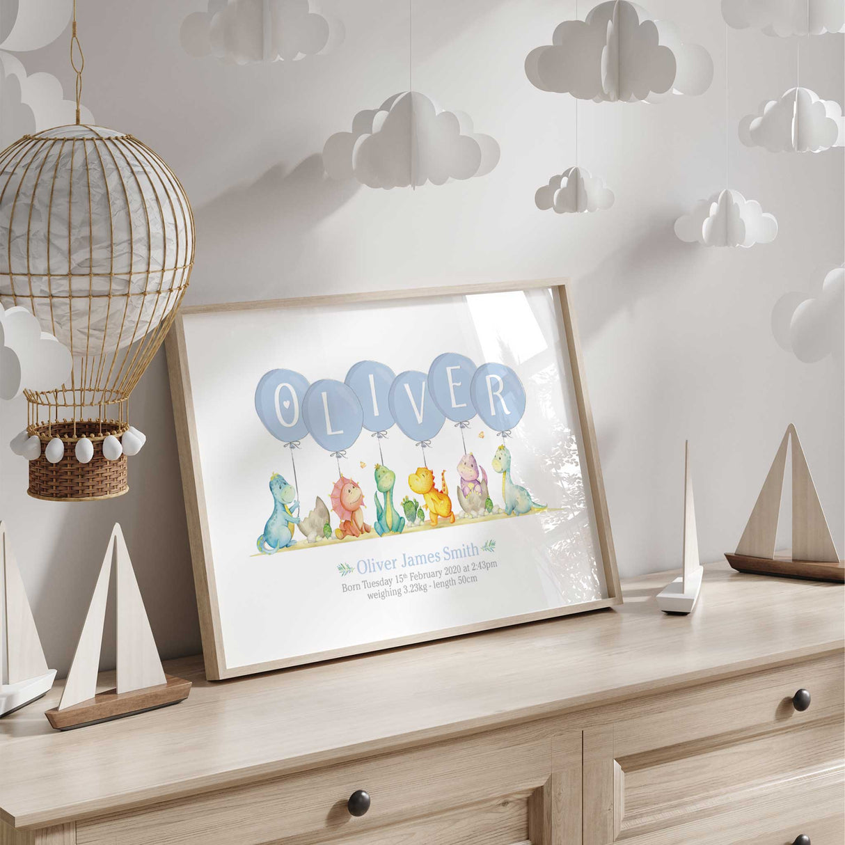 Personalised dinosaur nursery print with balloons spelling baby name