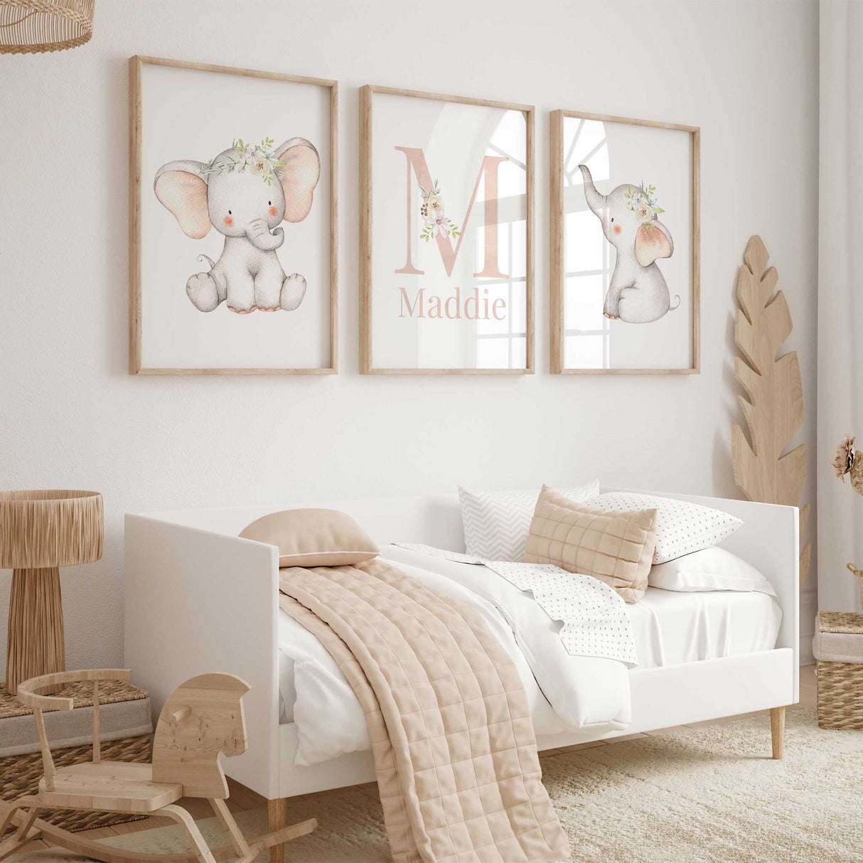 Girls personalised elephant nursery wall art set featuring floral elephants and child's name.
