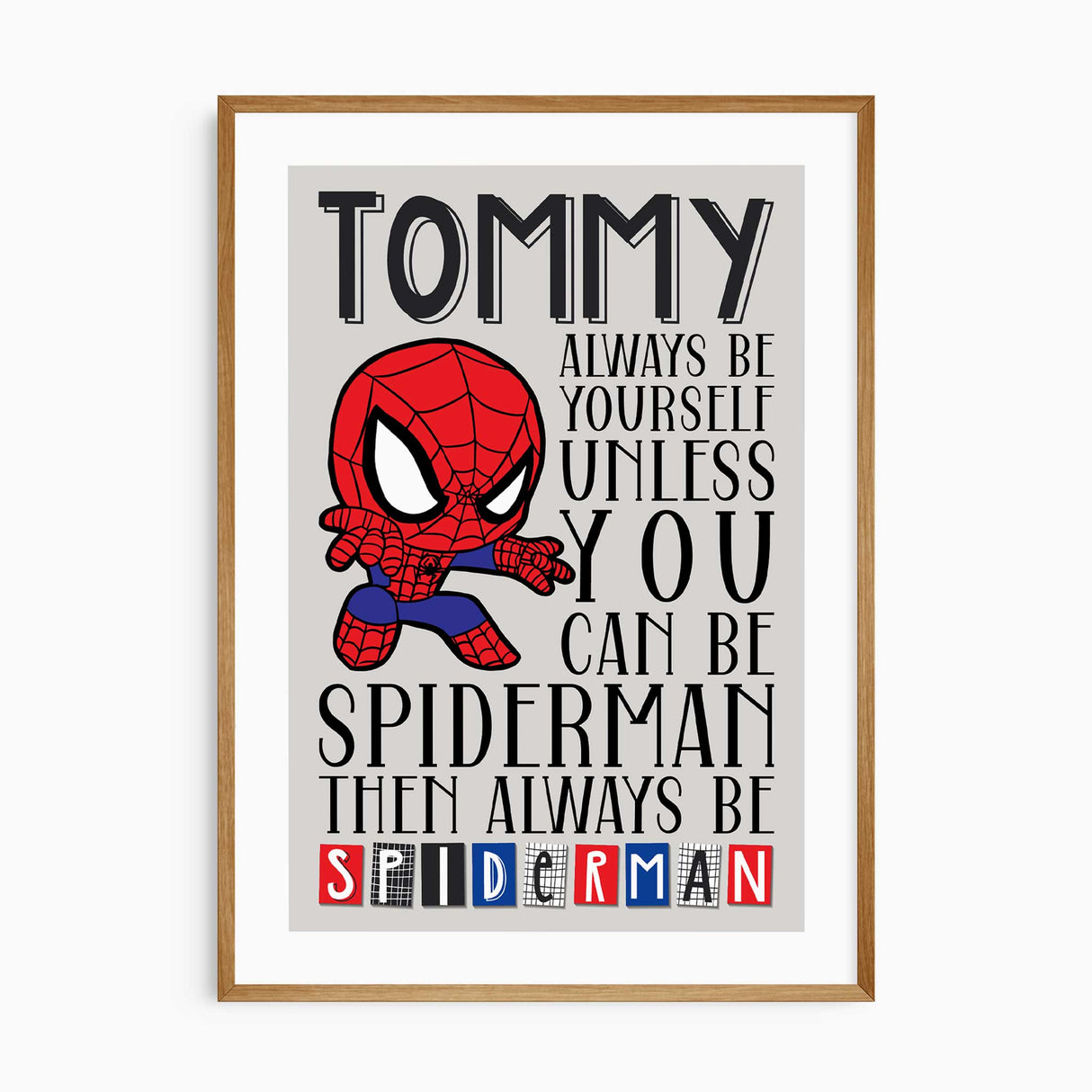 Personalised superhero wall art print for boys featuring name and inspirational quote “Always be yourself unless you can be a superhero,” with white border edge.