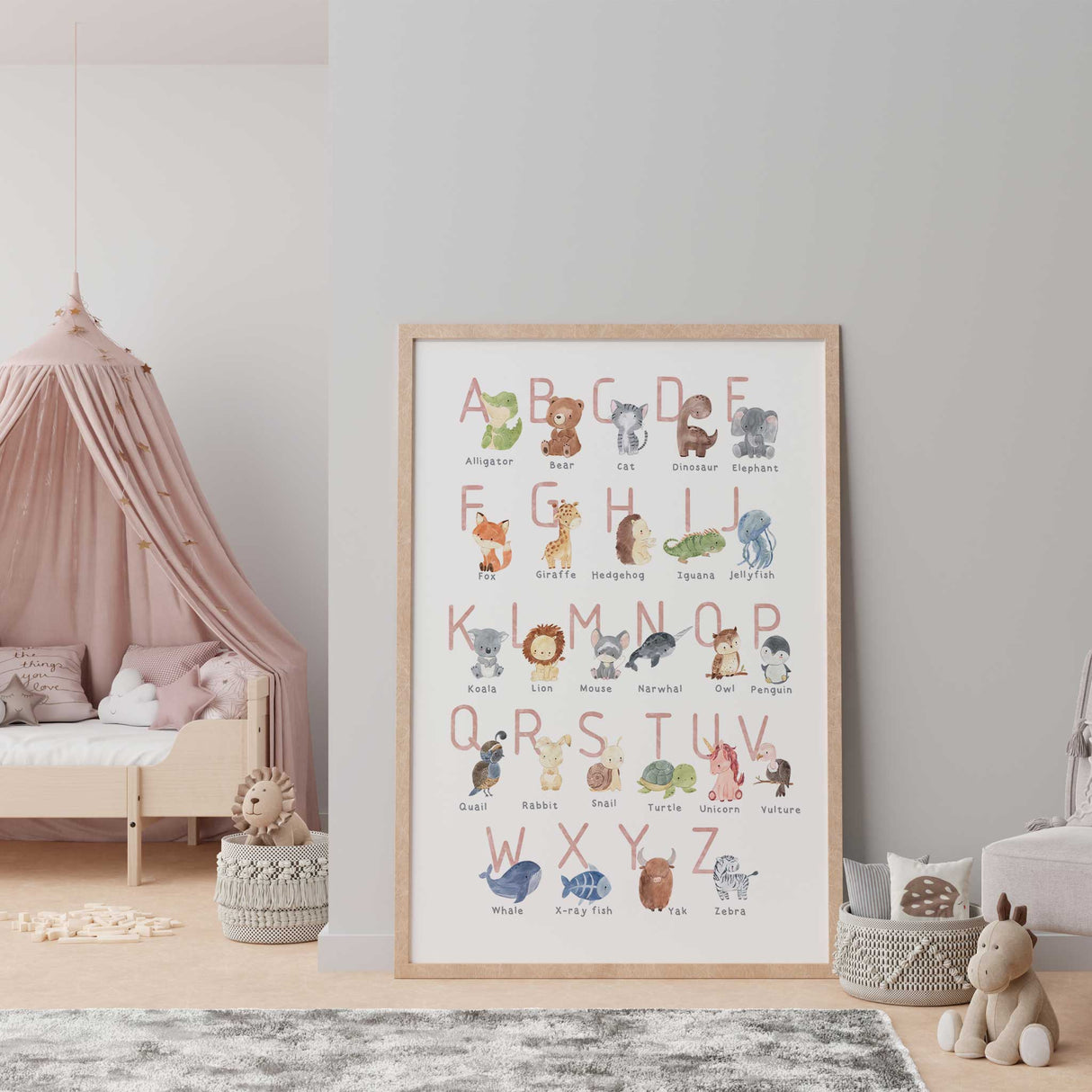 Animal alphabet wall art for girls featuring soft pink letters and sweet watercolor animals for baby girl nursery decor