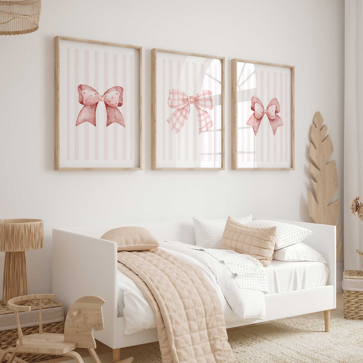 Pink bow wall art print with polka dot ribbon on striped background