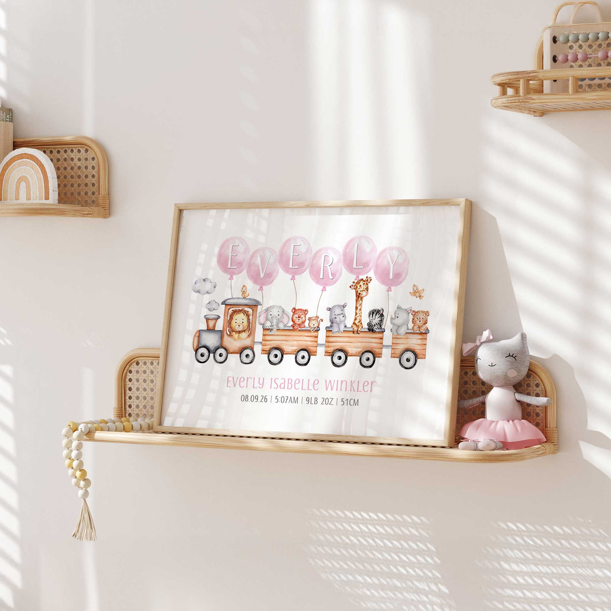 Pink safari animal birth details print with a wooden train, personalised name balloons and baby information