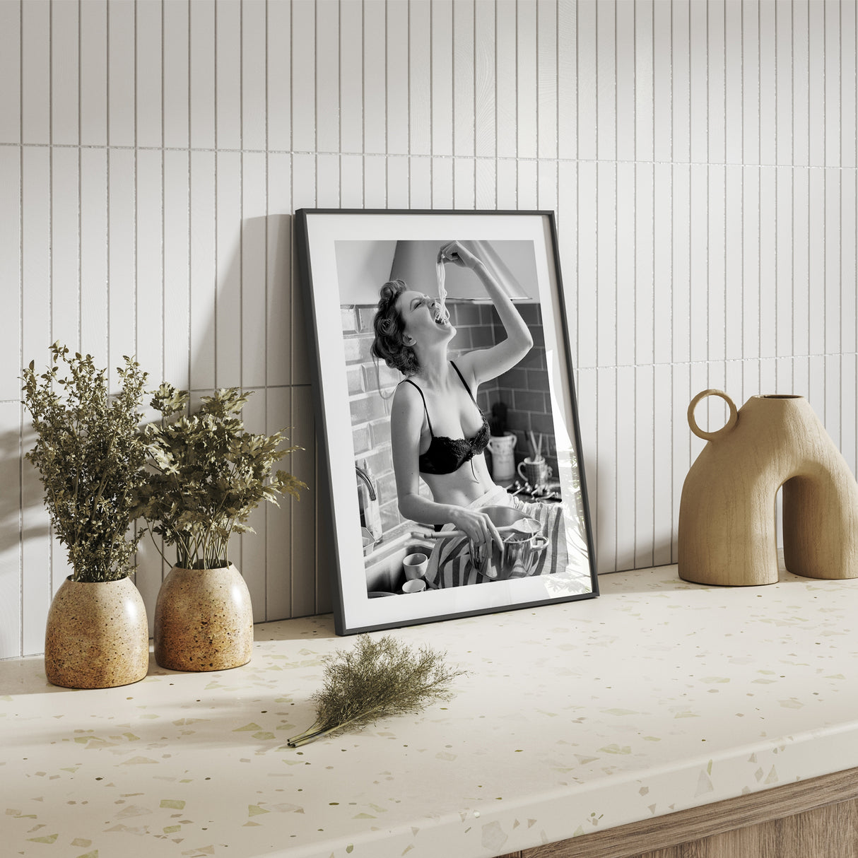 Retro-style pasta art print of a woman in lingerie eating spaghetti – cheeky and stylish kitchen decor.
