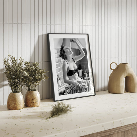 Retro-style pasta art print of a woman in lingerie eating spaghetti – cheeky and stylish kitchen decor.