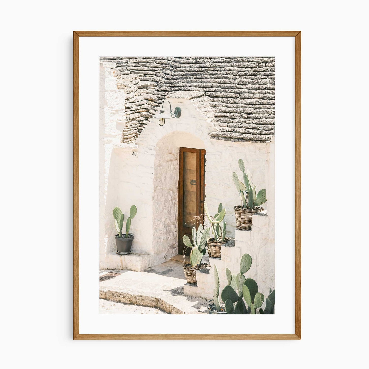 Rustic European architecture print with stone roof and cacti