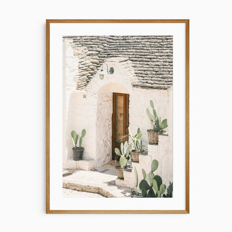 Rustic European architecture print with stone roof and cacti
