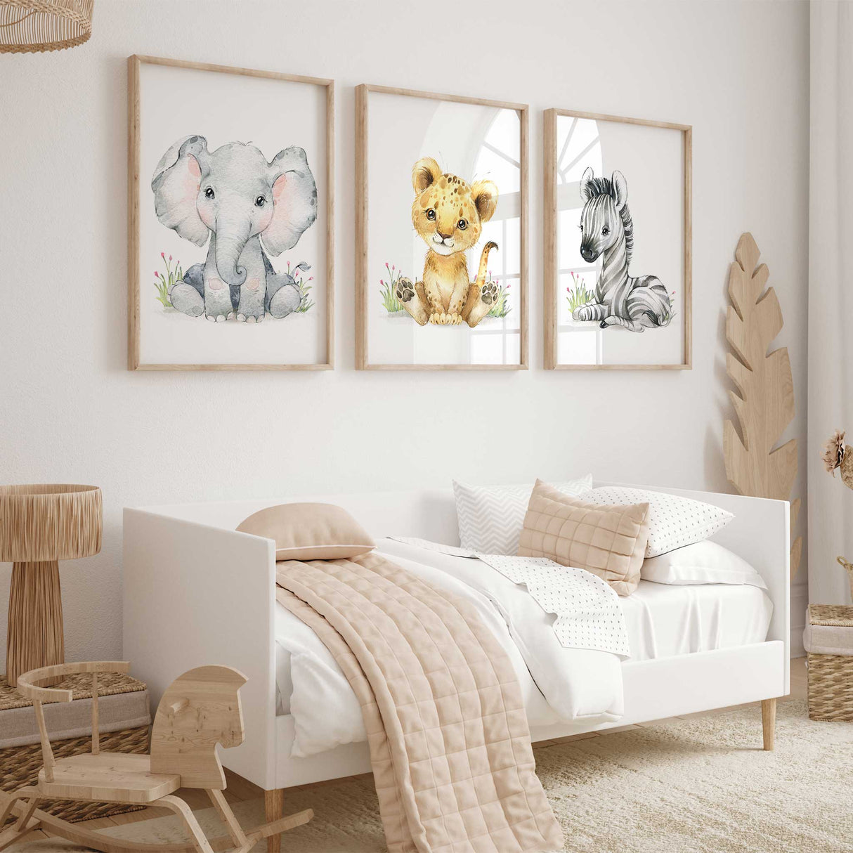 Safari animal nursery wall art set with elephant, lion cub, and zebra prints for girls