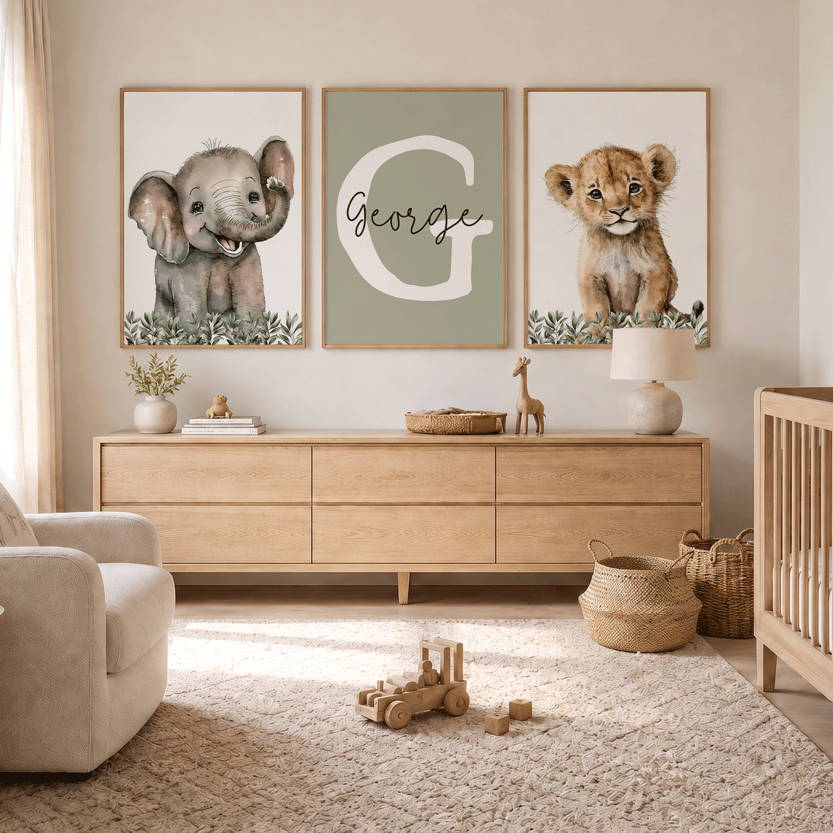 Safari nursery trio with leafy lion and elephant artwork and a white initial with custom name on sage green.