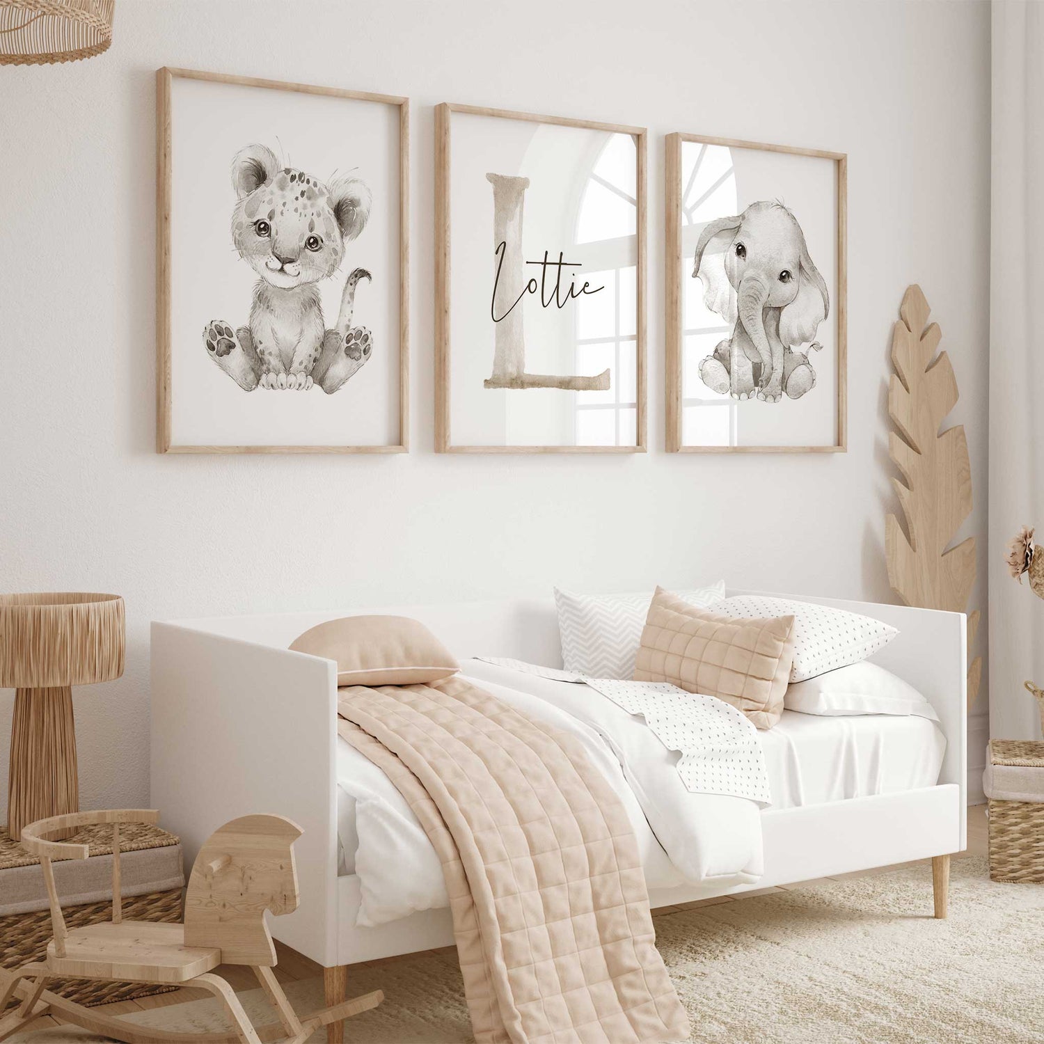 Neutral safari nursery décor featuring baby lion and elephant prints