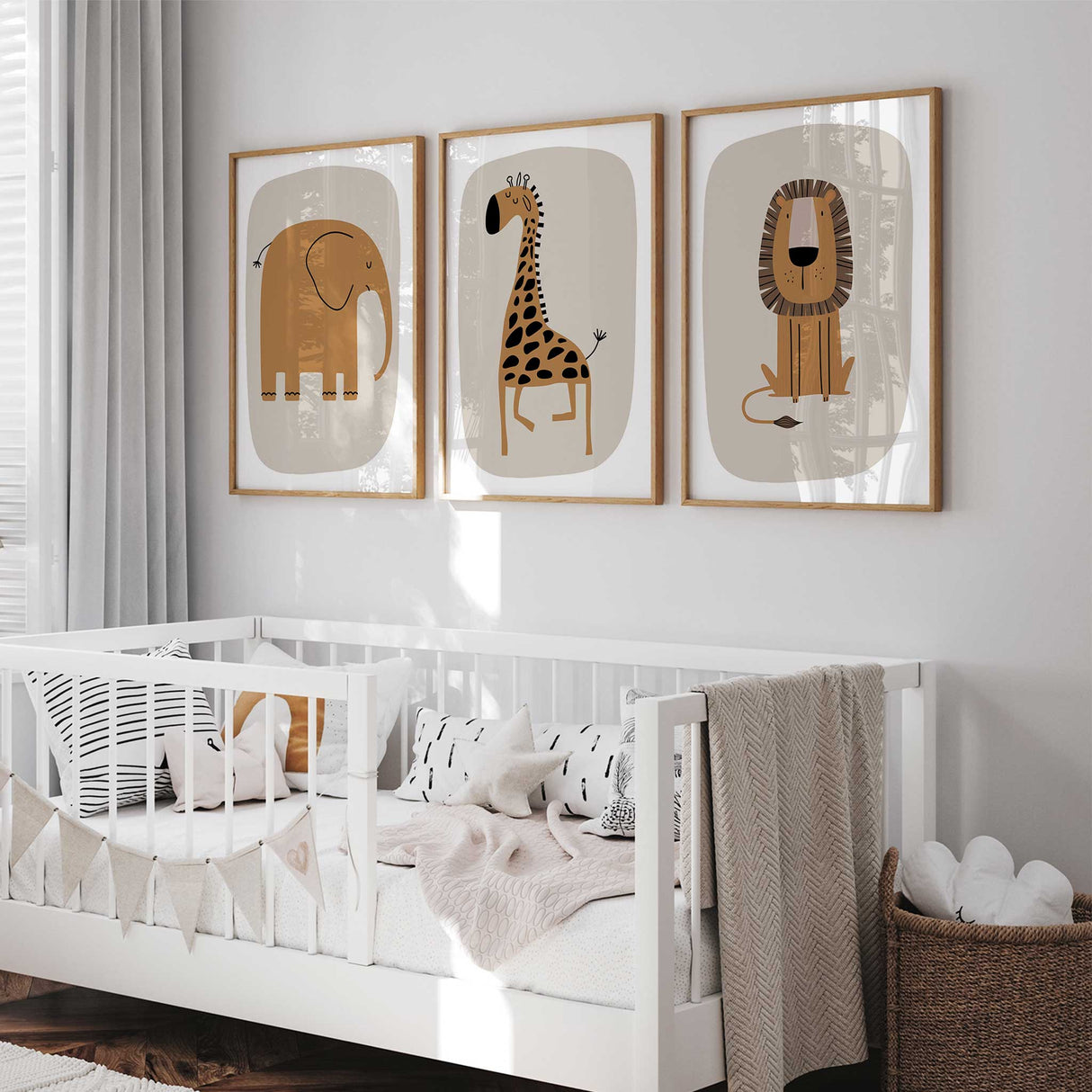 Minimalist elephant, giraffe, and lion prints on beige background for kids' safari bedroom decor.