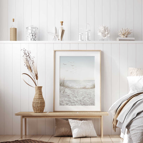 Tranquil beach print featuring sand dunes and seagulls over the sea.