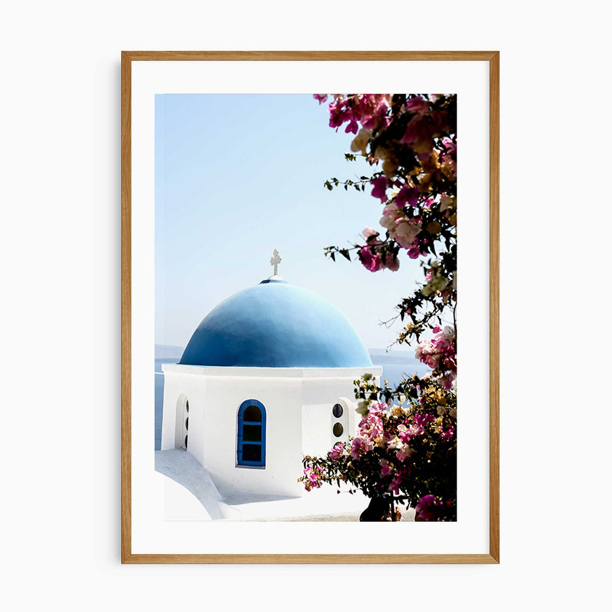 Modern wall decor set with travel photography prints from Santorini, Greece – blue and white aesthetic.
