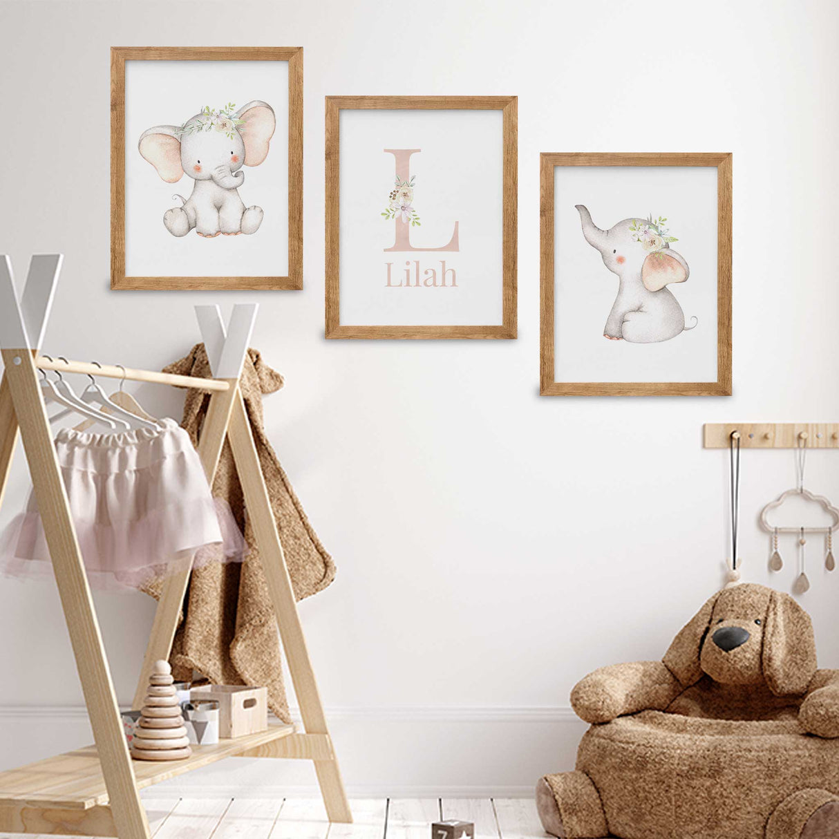 Set of 3 elephant prints with delicate floral crowns for girls' nursery decor.