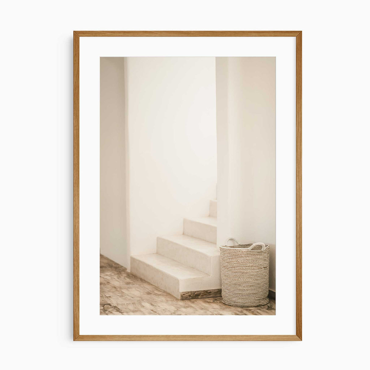 Soft-toned neutral wall print of staircase and woven basket