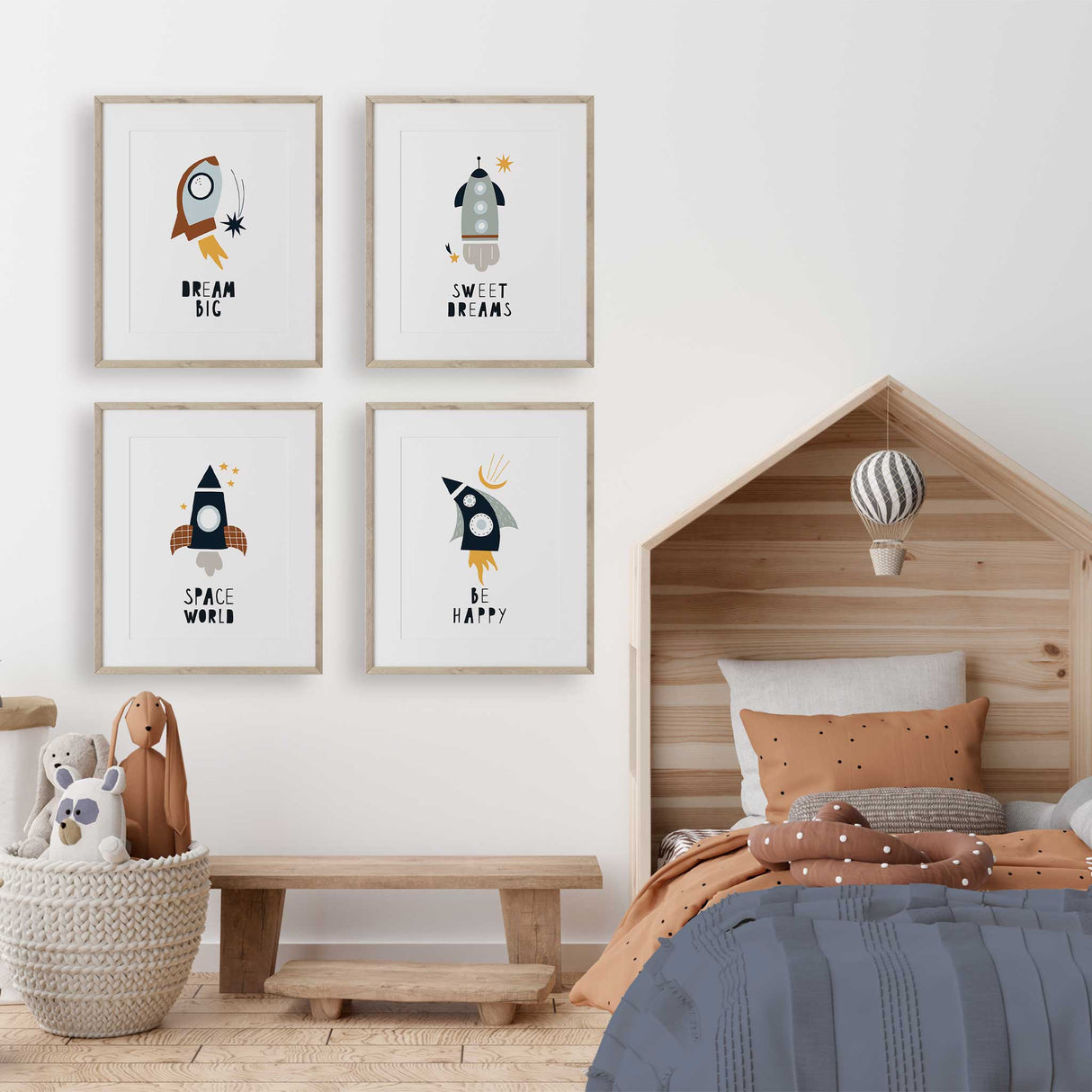 Space themed nursery prints with rockets, ideal for adding a touch of wonder to a boy's room.