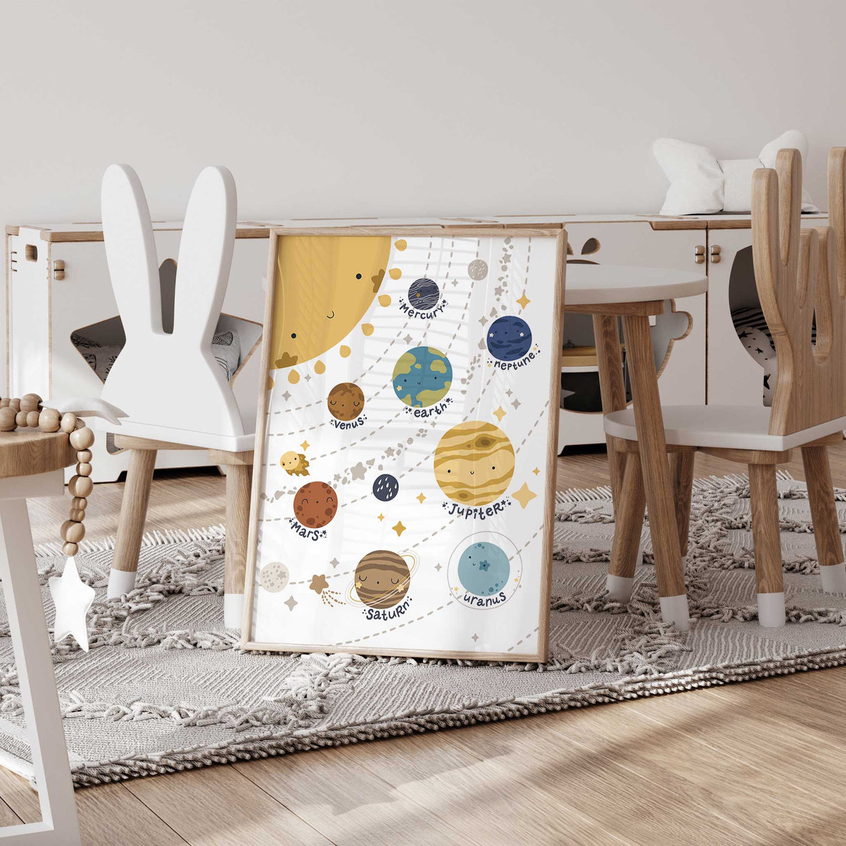 Whimsical space-themed nursery artwork with smiling planets