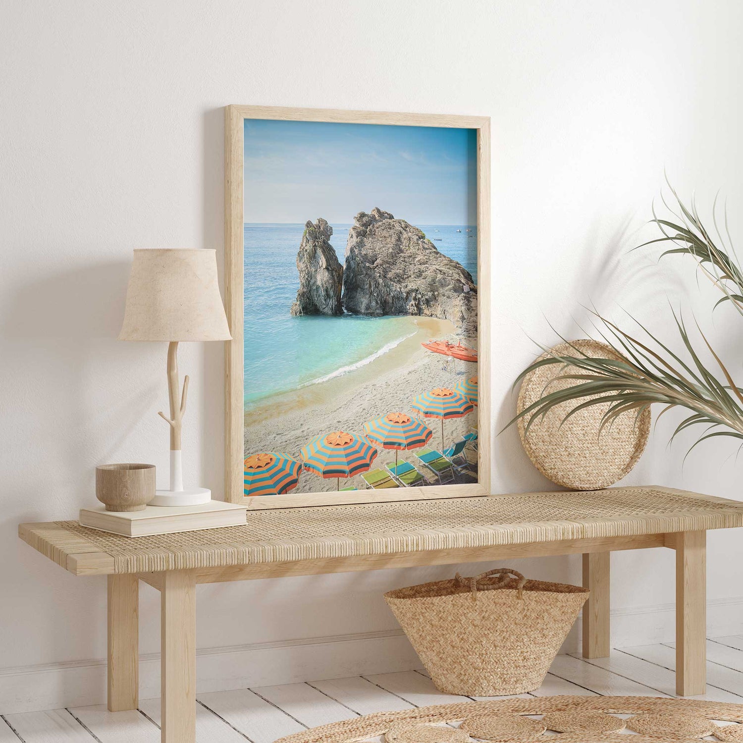 Striped orange and teal umbrellas on a sandy beach