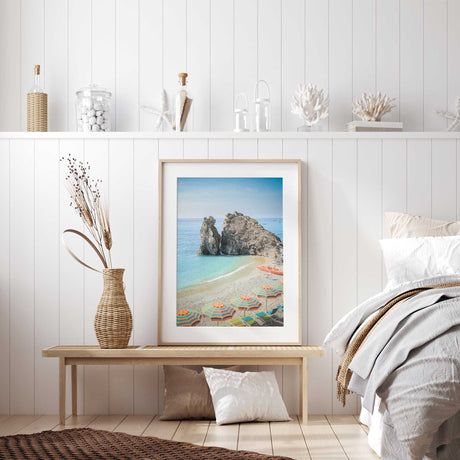 Summer beach setting with colourful umbrellas and calm sea