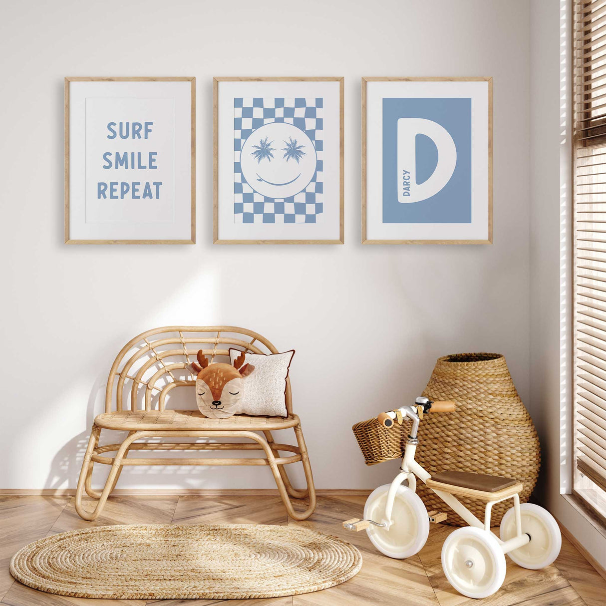 Surf nursery wall art set of three featuring surf smile repeat text print, smiley face artwork and personalised initial print in blue tones