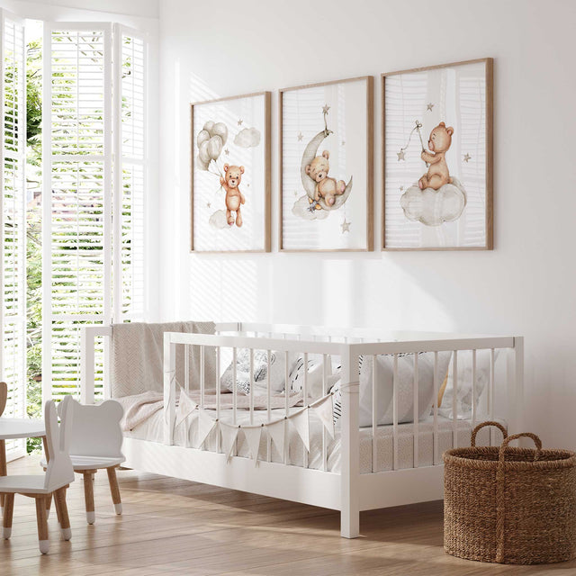 Set of 3 teddy bear nursery prints featuring bears with balloons, moon, and stars on clouds in soft neutral tones for baby rooms.