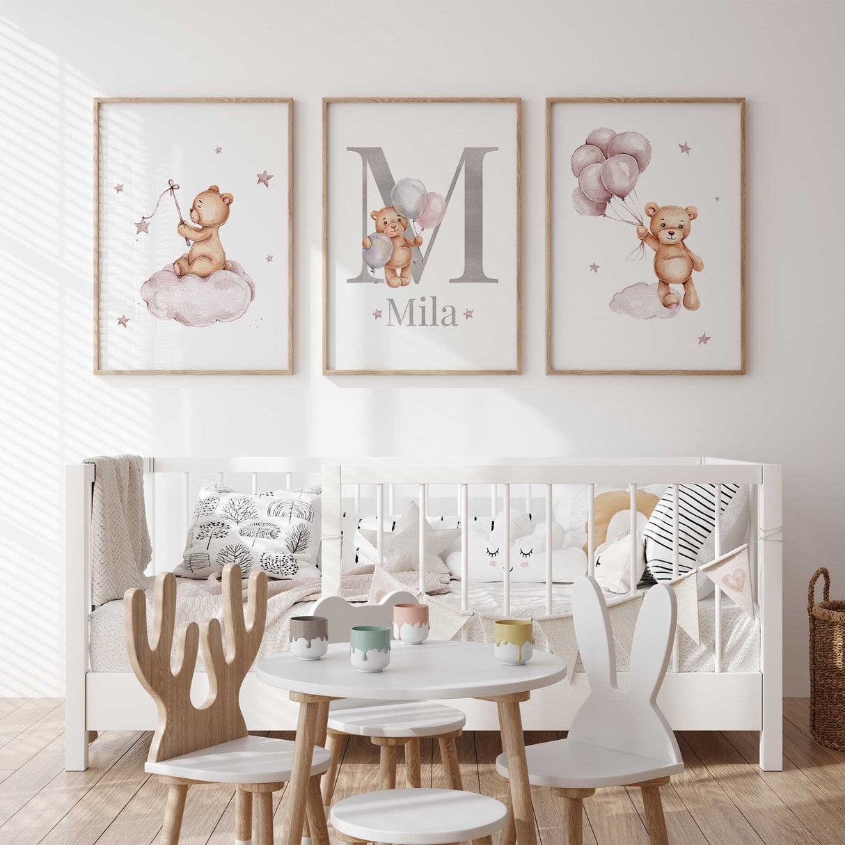 Three teddy bear nursery wall art prints for a baby bedroom. The left print shows a bear on a cloud, the center print features a large letter with the name and a small bear holding balloons, and the right print shows a bear holding pink balloons.