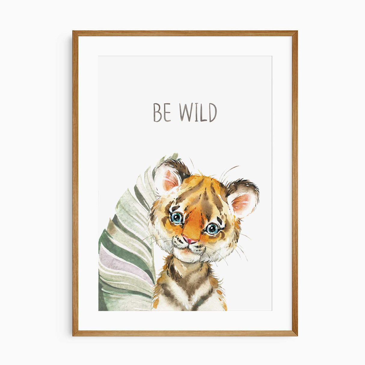 Cute tiger cub nursery wall art with tropical foliage, saying 'Be Wild'."