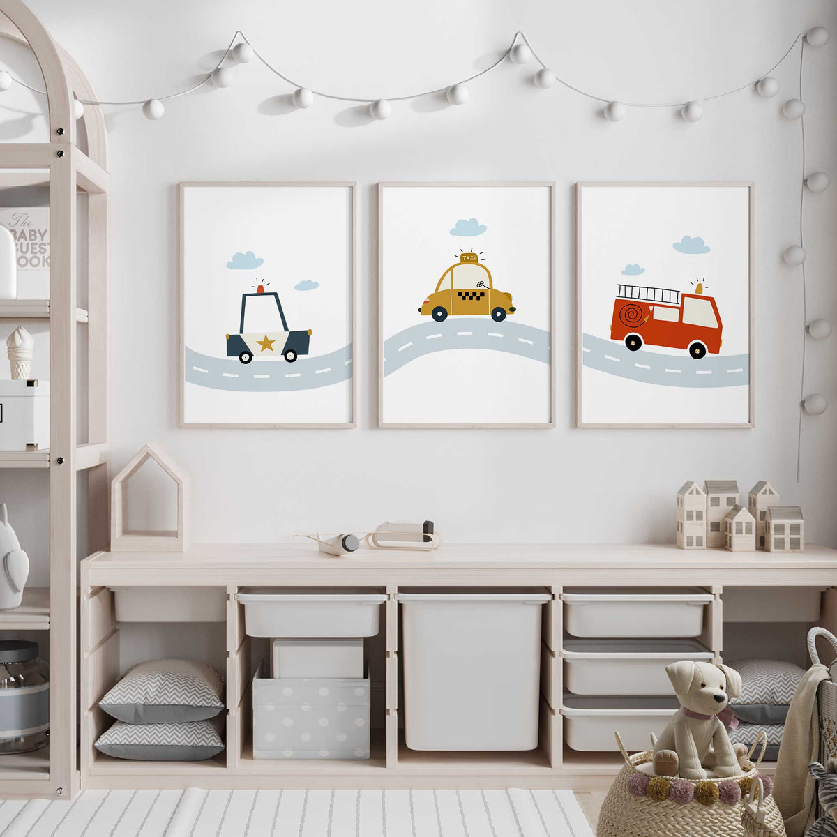 Transport wall art set of three with simple police car, taxi and fire engine illustrations on white backgrounds.