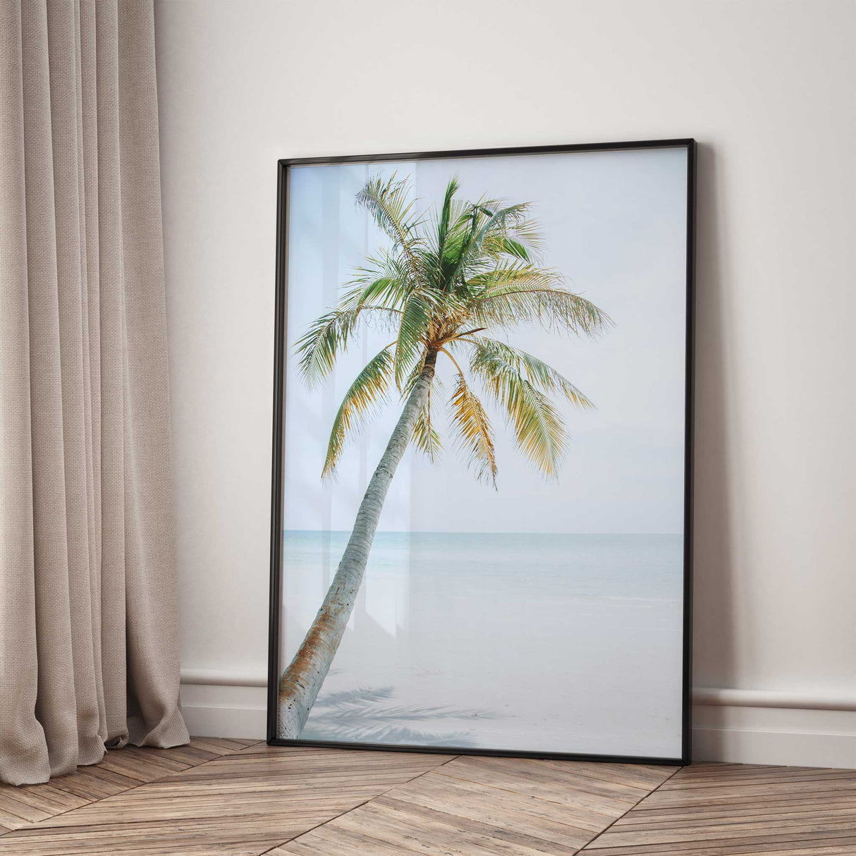 Tropical beach wall decor print featuring leaning palm tree and calm sea