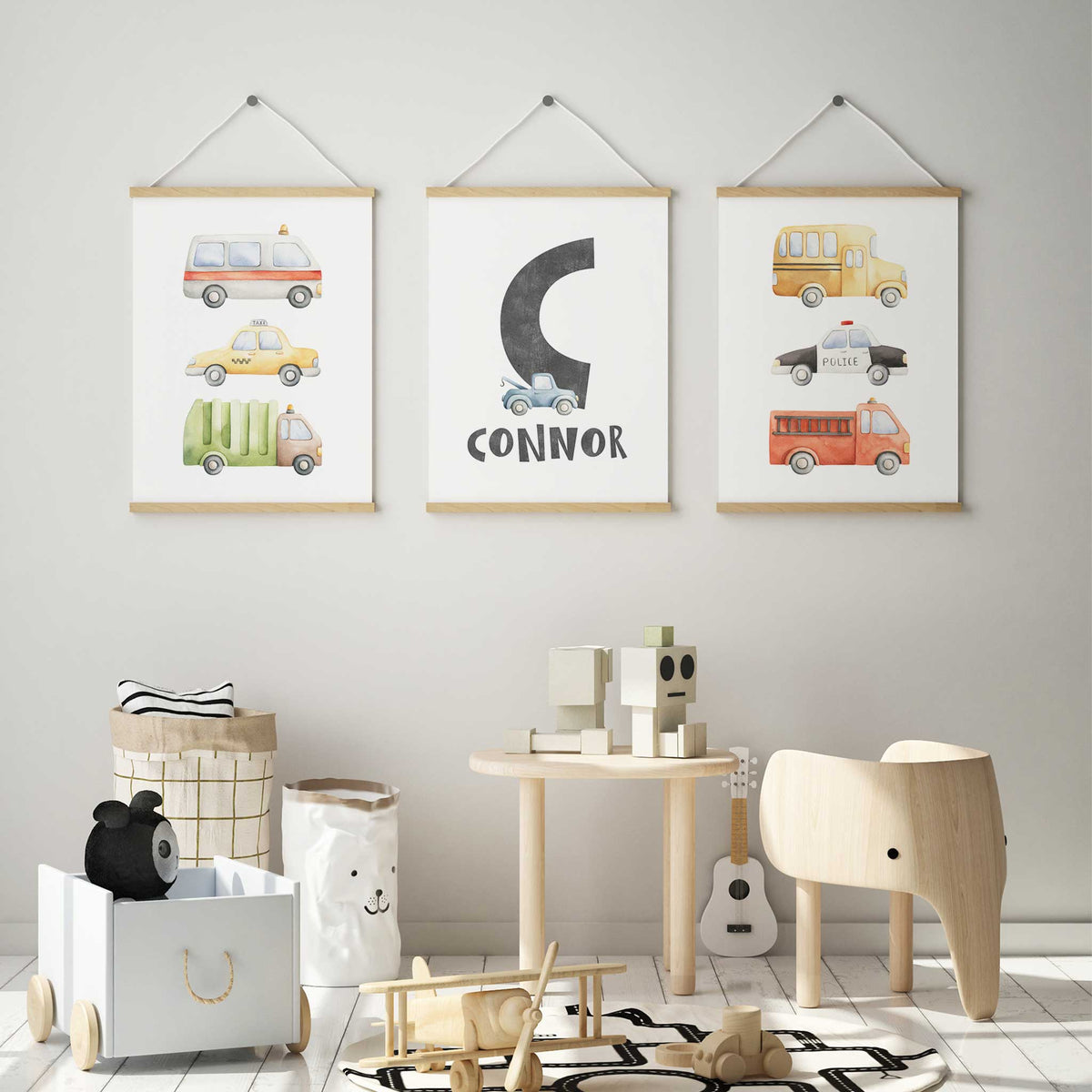 Three vehicle prints with watercolour cars, bus and trucks, and a grey initial, name and blue tow truck.