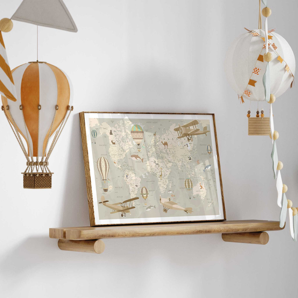 Vintage world map wall art for kids featuring hot air balloons, aeroplanes and animals in soft neutral tones for nursery or playroom decor