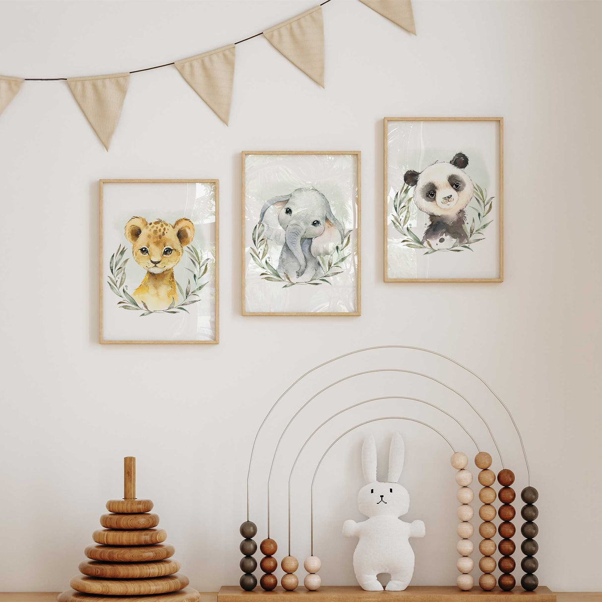 Watercolour panda, lion, and elephant nursery prints in soft green botanical style