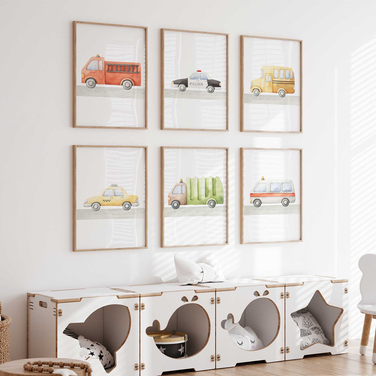 Six watercolour vehicle prints showing a fire truck, police car, school bus, taxi, rubbish truck and ambulance.