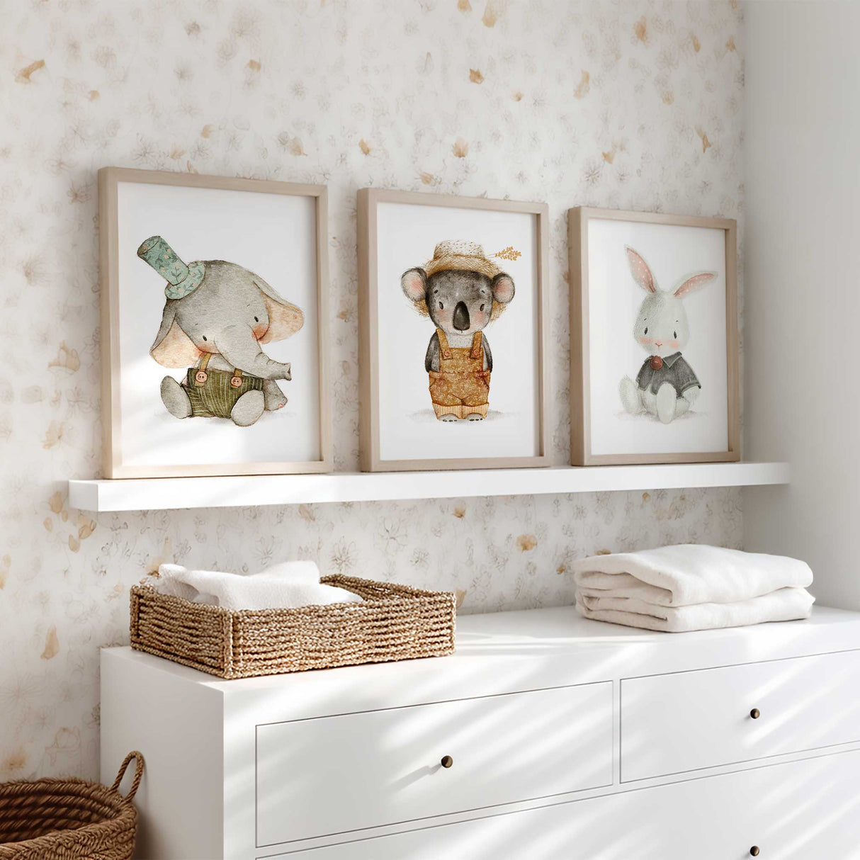 Set of three baby woodland nursery animal prints featuring an elephant, koala and bunny in soft neutral colours for baby room or kids wall art décor.