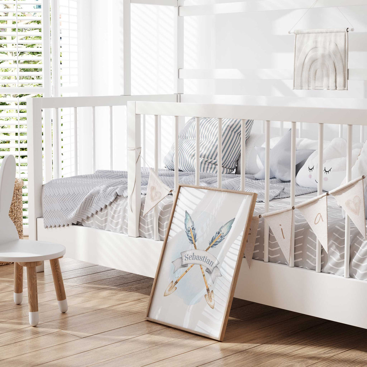 Personalised woodland nursery name print for boys featuring crossed arrows and blue feathers on a soft watercolour background.