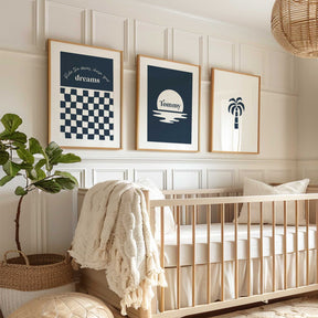 Minimalist kids nursery prints featuring a palm tree, moonlit ocean and motivational quote Ride the waves, chase your dreams in navy and white.