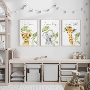 Safari nursery wall art set featuring lion cub, elephant, and giraffe watercolor prints with inspirational quotes.