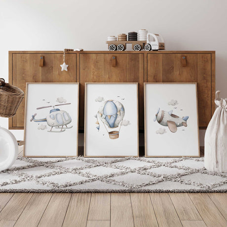 Set of three airplane nursery prints featuring a blue helicopter, hot air balloon and aeroplane with clouds