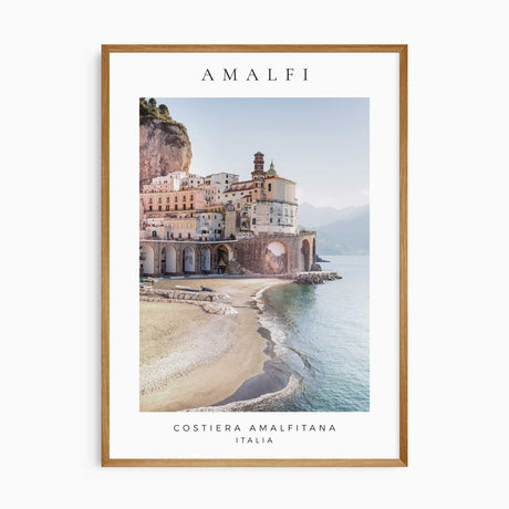 Amalfi Coast photography print with pastel waterfront buildings, a curved beach and blue sea beneath an Amalfi heading.