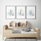 Set of three watercolour prints with zebra, giraffe and elephant pilots in mint aeroplanes, with clouds and stars on white.