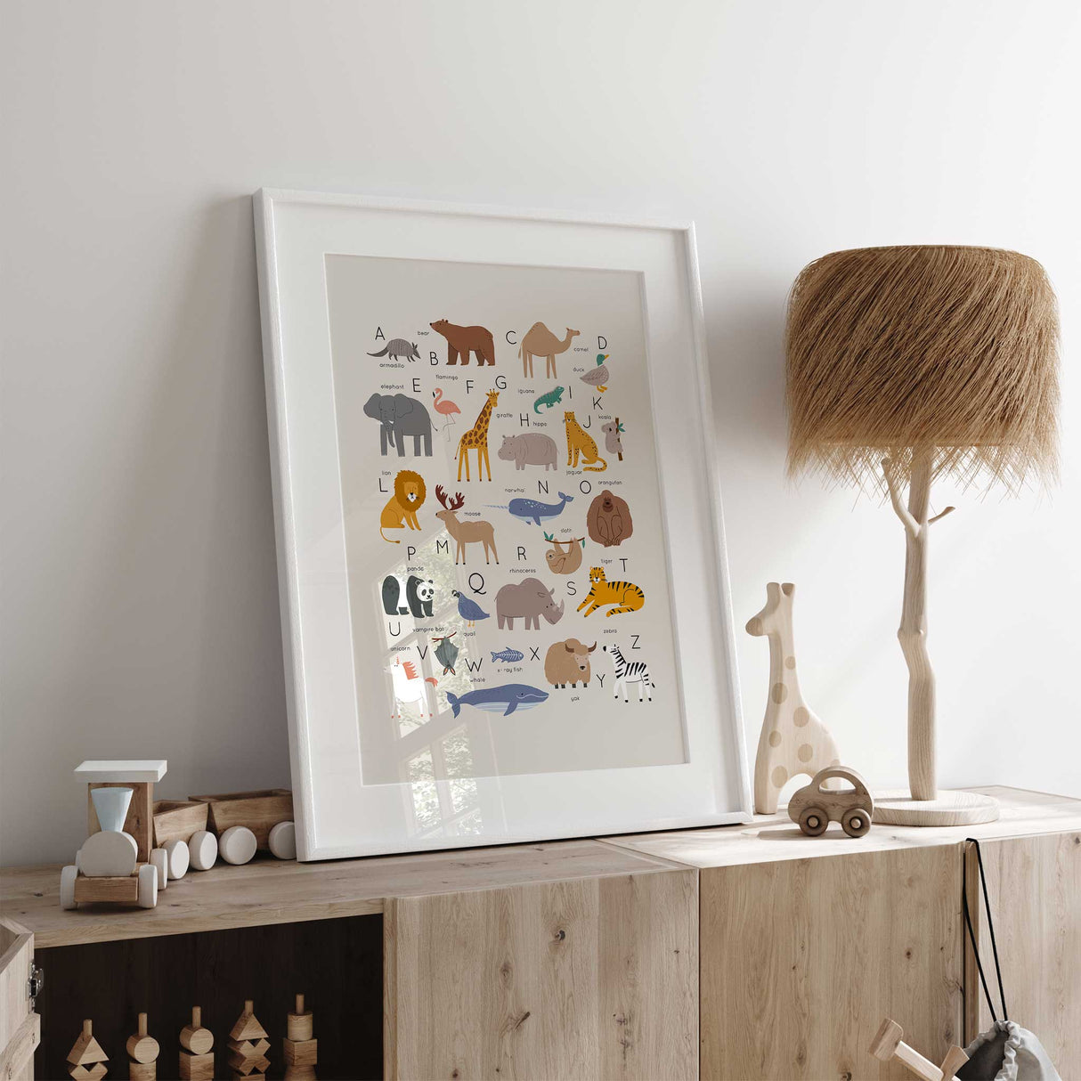 Animal alphabet nursery wall art print featuring A to Z animals in soft neutral tones for kids bedroom or playroom decor