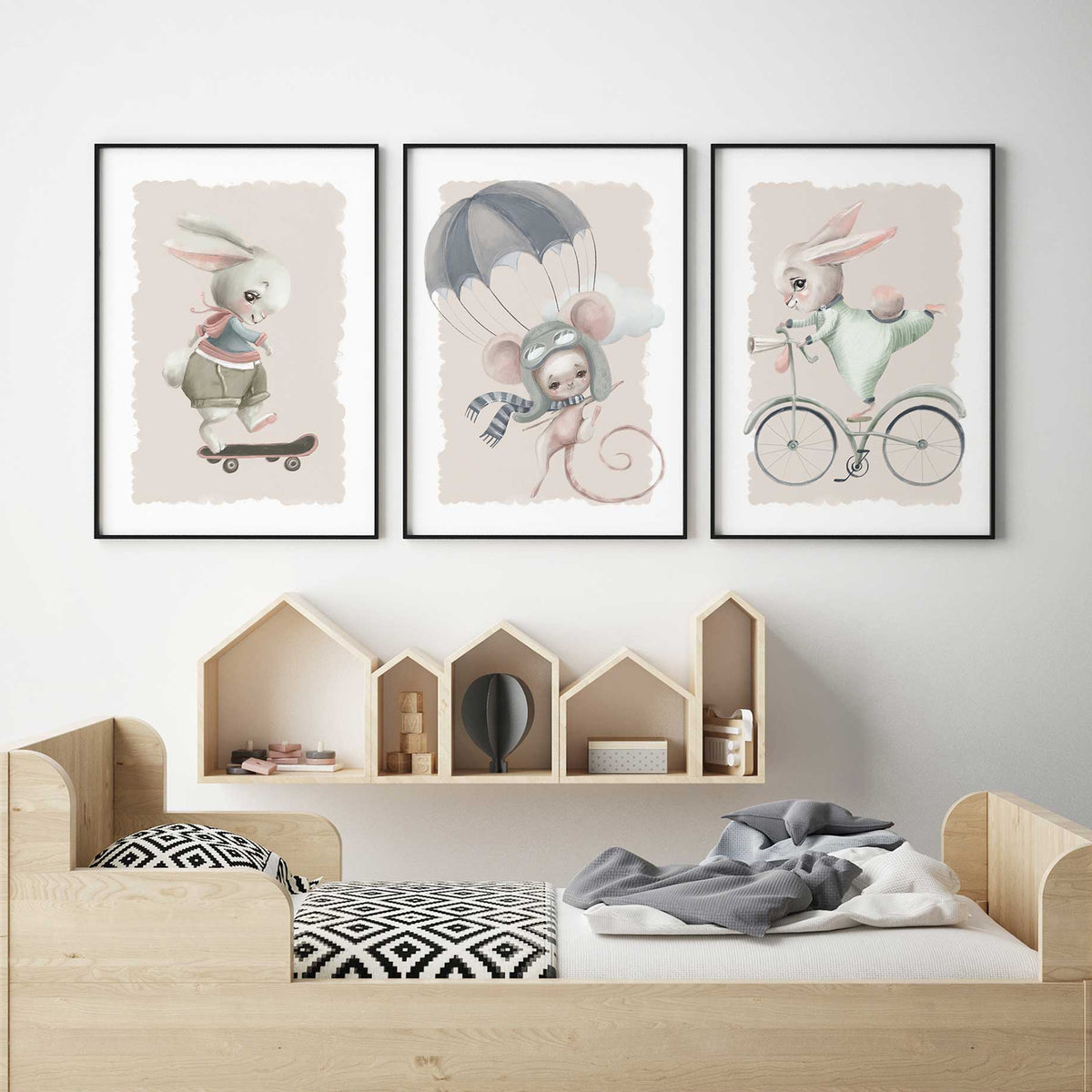 Three animal nursery prints with a skateboarding bunny, parachuting mouse and cycling bunny on soft beige backgrounds.