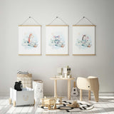 Three animal aeroplane prints featuring a giraffe, elephant and zebra in pale mint planes with clouds and star details.