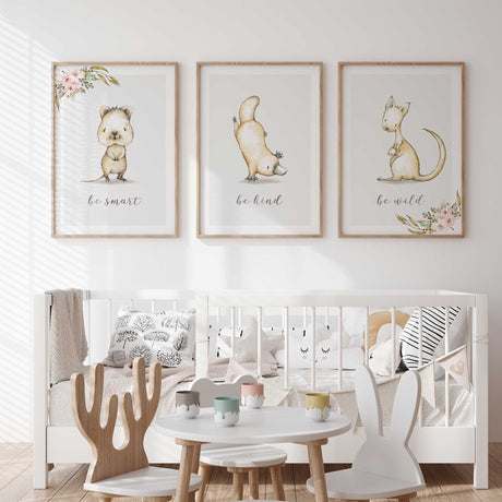 Australian animal prints featuring a wombat, platypus and kangaroo with pink floral corners and positive script wording.